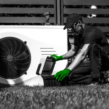 Engineer adds final few touches to heat pump installation